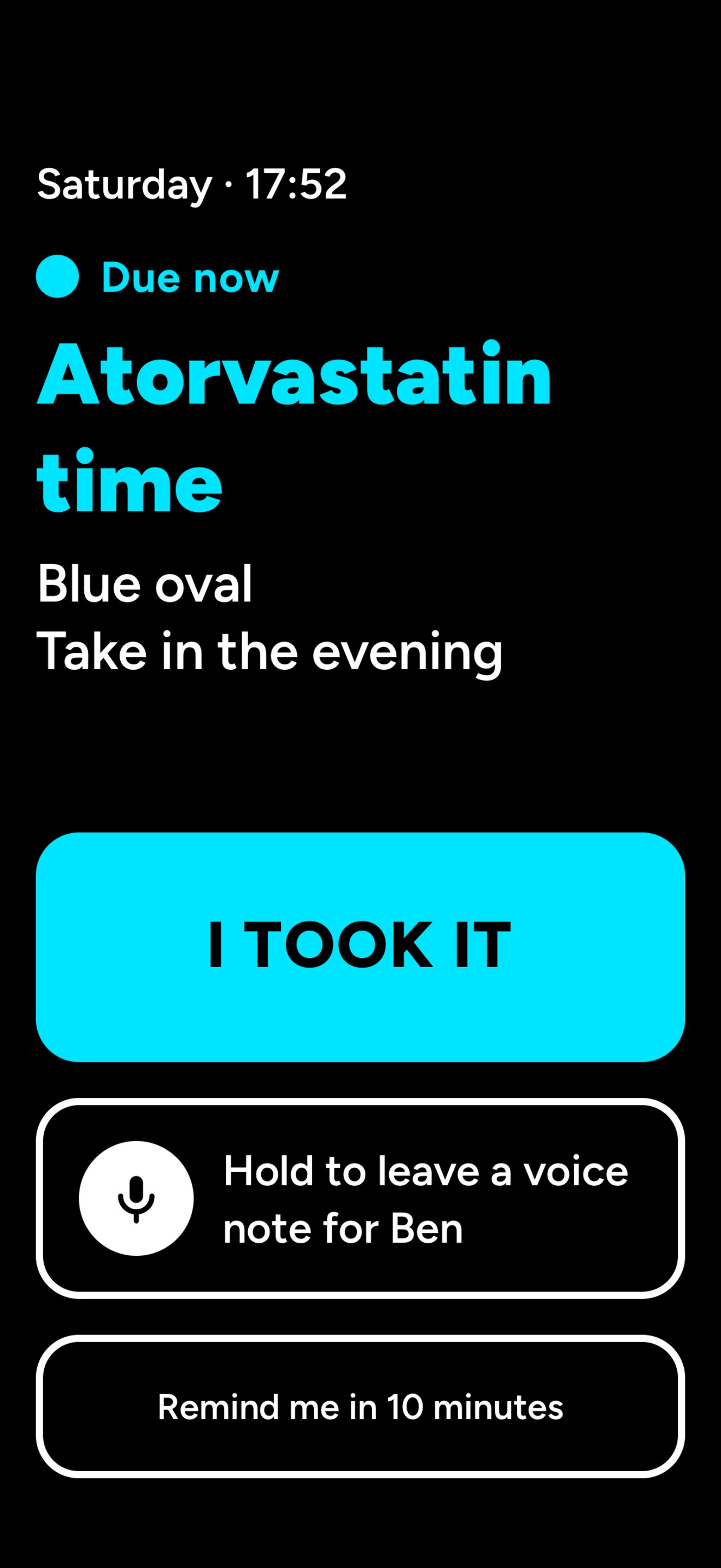 Kinfocus patient screen in high-contrast black and cyan, reading Atorvastatin time, Blue oval, Take in the evening, with a giant I TOOK IT button